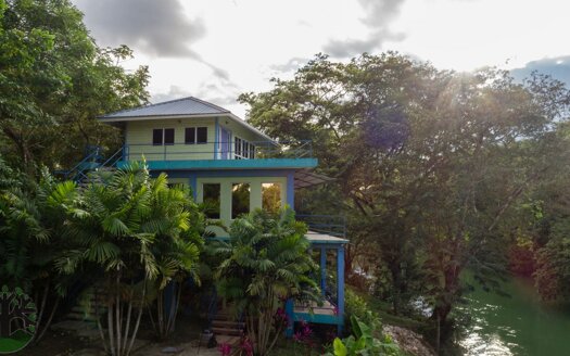 A stunning, three-storey villa enjoying a remarkable position on the banks of the Mopan River, with picturesque views and a spectacular blend of tropical living & lifestyle!